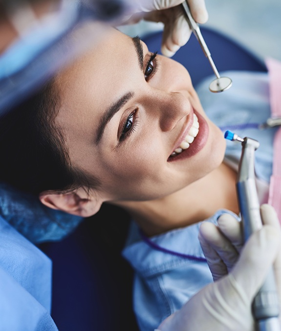 close up of woman smiling while getting a dental checkup