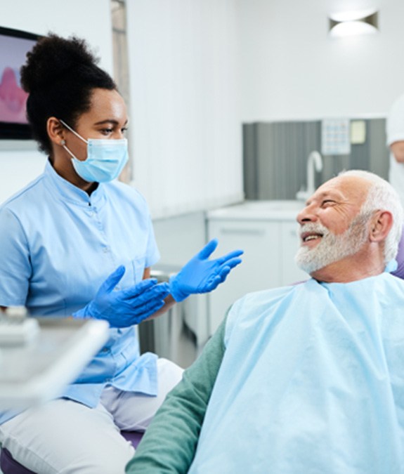 Dentist talking to a patient