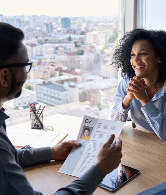 Woman smiling during job interview in office